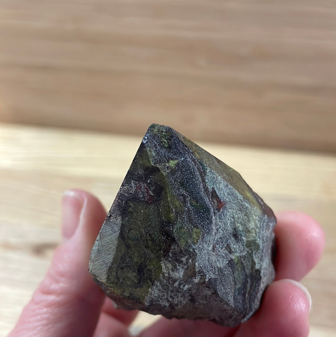 Dragons Blood Raw with cut and polished point