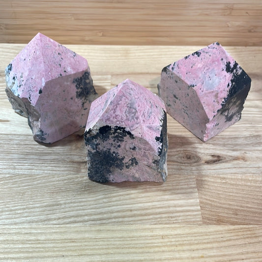 Rhodonite Raw with cut and polished point